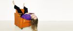 VISMA_GIRL_COUCH_UPSIDEDOWN_PURPLEGLOW.jpg