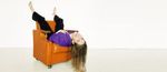 VISMA_GIRL_COUCH_UPSIDEDOWN_PURPLEGLOW.jpg